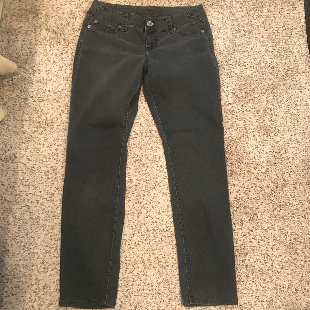 Distressed faded black skinny jeans